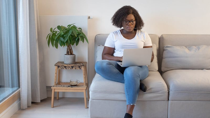 talent-marketplace-woman-on-couch-laptop